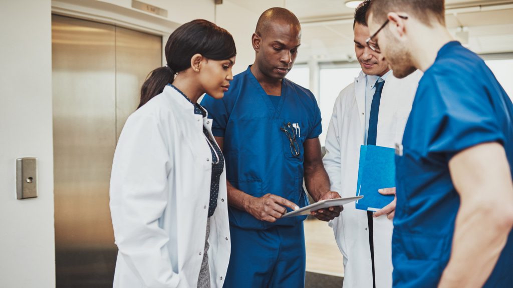 Doctors standing around discussing