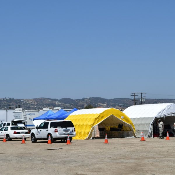 Forensic tents and police vehicles